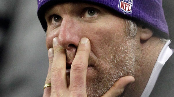 This Dec. 13, 2010, file photo shows Minnesota Vikings quarterback Brett Favre watching the game against the New York Giants from the bench during the fourth quarter at Ford Field in Detroit. (AP / Paul Sancya) 