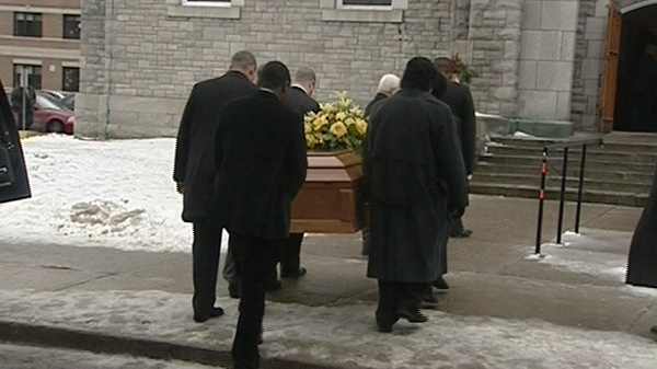 Mourners carry the casket of nine-year-old Olisadike "Oli" Okoye into St. Joseph's Cathedral in Ottawa, Wednesday, Dec. 29, 2010.