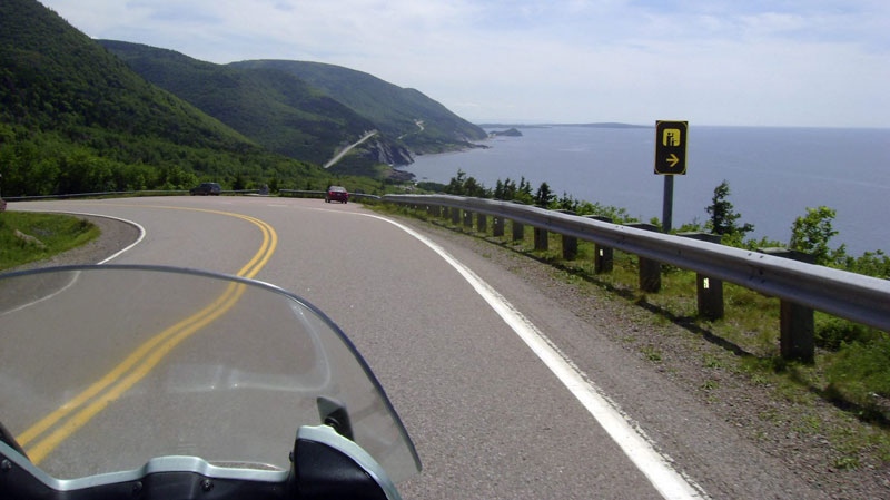 This July 13, 2010 photo shows the road along the eastern edge of Cape Breton Island during a 1,555-mile motorcycle tour along the Cabot Trail in Cape Breton, Nova Scotia. (AP Photo/Glenn Adams)