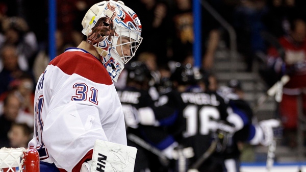 Montreal Canadiens goalie Carey Price (31) reacts as Tampa Bay Lightning players celebrate a second-period goal by Martin St. Louis during an NHL hockey game Thursday, Dec. 30, 2010, in Tampa, Fla. (AP Photo/Chris O'Meara)