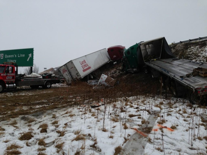 Two tractor trailers collided and ended up on the embankment of the Queens Line overpass near Tilbury, Ont., Jan. 28, 2013. (Sacha Long / CTV Windsor)