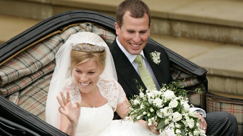 Peter Phillips, the eldest grandson of the Queen and Canadian Autumn Kelly leave St. George's Chapel in Windsor, England, after their marriage ceremony, Saturday, May 17, 2008. (AP / Sang Tan)