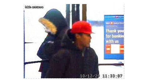 Two male suspects are seen in surveillance footage taken during a robbery at a Bank of Montreal branch on Richmond Road, Wednesday, Dec. 29, 2010.