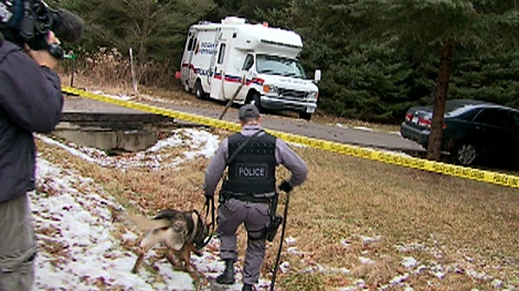 Ontario Provincial Police investigate the scene of a "savage attack" that left a 73-year-old Ancaster, Ont., woman dead.