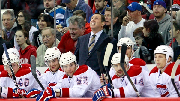 Montreal Canadiens coach Jacques Martin looks up at the scoreboard during the first period of an NHL hockey game against the Carolina Hurricanes in Raleigh, N.C., Thursday, Dec. 23, 2010. Montreal won 3-2. (AP Photo/Gerry Broome)
