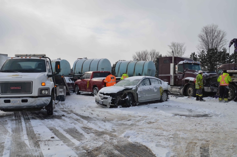 Damaged vehicles are seen following a multi-vehicle crash on the eastbound Highway 401 near Woodstock, Ont. on Friday, Feb. 1, 2013. (Andrew Collins / CTV News)