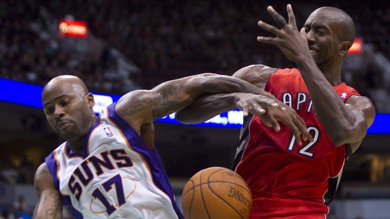 Phoenix Suns' Chucky Atkins, left, knocks the ball away from Toronto Raptors' Ronald Dupree during the second half of NBA pre-season basketball action at the Rogers Arena in Vancouver, Wednesday, Oct. 6, 2010. (THE CANADIAN PRESS/Jonathan Hayward)