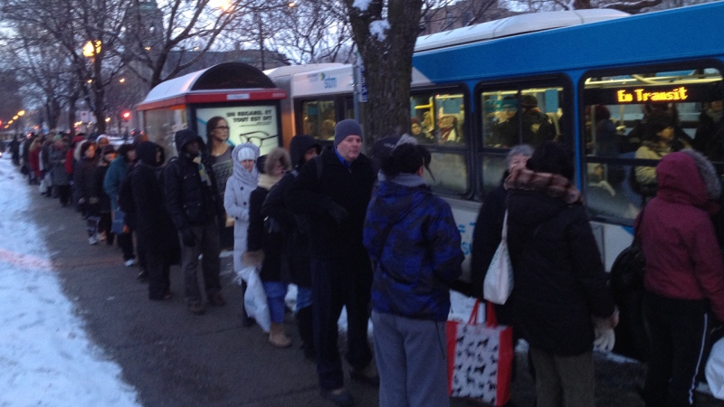 Hundreds of people wait in line for special shuttle buses after service broke down on the Montreal metro's Green line (CTV Montreal/Jean-Luc Boulch)