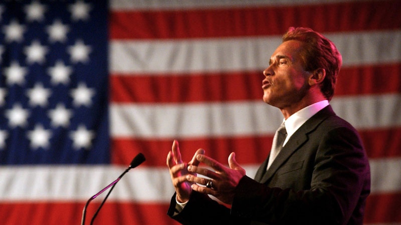 In this file photo taken Nov. 17, 2003, Gov. Arnold Schwarzenegger gestures while speaking before the California Chamber of Commerce reception held in his honor following his inauguration in Sacramento, Calif. (AP Photo/Rich Pedroncelli, File)