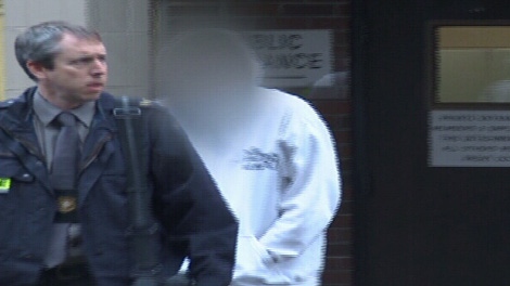 Dennis John Allen Warrington of Langley, 19, is seen being arrested in connection with a B.C. gang rape. Warrington is charged with making and distributing child pornography. (RCMP handout)