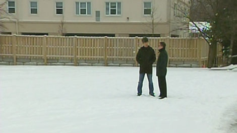 Benny Afrouzi and Kevin Cheung, who each own businesses in the Campus Court Plaza, stand in the centre's empty lot in Waterloo, Friday, Jan. 7, 2011.