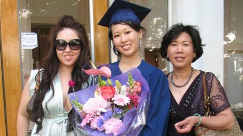 Elisa Lam, middle, posed with her sister and mother in this Facebook image. LAPD say the body of a woman found wedged in a water tank on the roof of a downtown hotel is that of the missing Canadian guest.