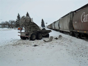 The aftermath of a collision between a semi-trailer and a train in Wadena on Thursday is seen in this photo provided by RCMP.