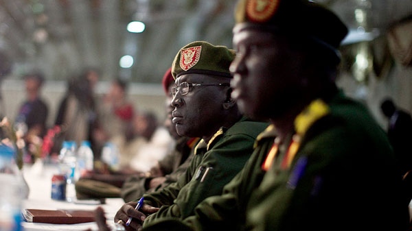 Senior members of the southern Sudan People's Liberation Army (SPLA) are seen during the signing of ceasefire agreement with southern rebel leader representative of Lt. General George Athor in Juba, southern Sudan on Wednesday, Jan. 5, 2011. (AP / Pete Muller) 