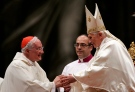 Pope Benedict XVI greets Cardinal Marc Ouellet, of Canada, president of the Pontifical Commission for Latin America, left, at the beginning of a mass for Latin America, in St. Peter's Basilica at the Vatican, Monday, Dec. 12, 2011. (AP / Riccardo De Luca)