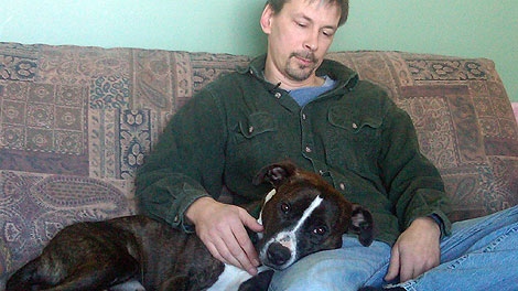 Steve Kolesar and his pit bull Moose share a moment together.