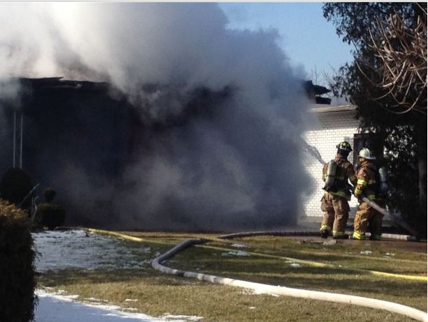 Tecumseh firefighters put out a blaze on Lesperance Road near Oliver Drive, Feb. 13, 2013. (Gina Chung / CTV Windsor)