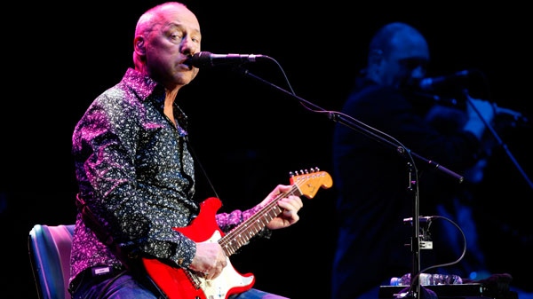 British musician Mark Knopfler , well known his time when he played with the band 'Dire Straits', performs on stage at the Festhalle in Frankfurt am Main, Germany, on Monday, June 7, 2010. (AP / dapdMario Vedder)