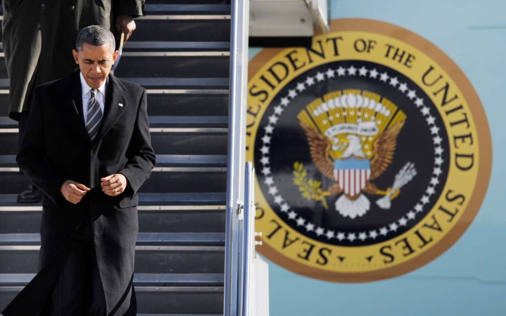 Barack Obama walks off Air Force One