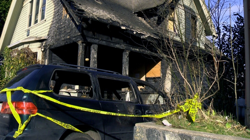 Authorities investigate a house fire in Victoria on Sunday, Feb. 17, 2013.
