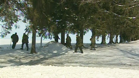 Police search the area near where Brenda Duncan's van was found west of Tavistock, Ont. on Monday, Jan. 17, 2011.