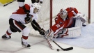 Ottawa Senators  center Chris Kelly tries to get the puck past Washington Capitals goalie Michal Neuvirth from The Czech Republic in the second period of an NHL hockey game in Washington Sunday, Jan. 16, 2011.(AP Photo/Alex Brandon)