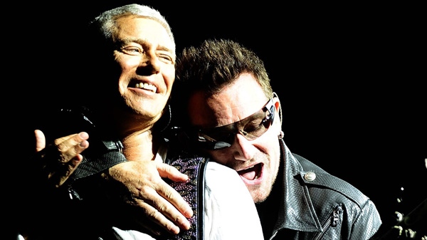 Bono, right, and Adam Clayton of Irish band U2 perform during their first concert of the new European tour after Bono underwent back surgery following an injury during training, in Turin, Italy, Friday, Aug. 6, 2010. (AP Photo/Massimo Pinca)