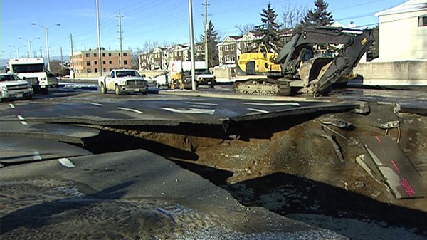 A watermain break caused a massive hole on Woodroffe Avenue, Friday, Jan. 14, 2011.