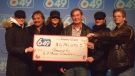 Winners of the $6.8 million jackpot, from left, Gurabie Alievski, Chuck Terry, Qerime Alievski, Brian Hutchins, Shuki  Alievski and Kevin Ray claim their prize in Toronto. (Courtesy OLG)