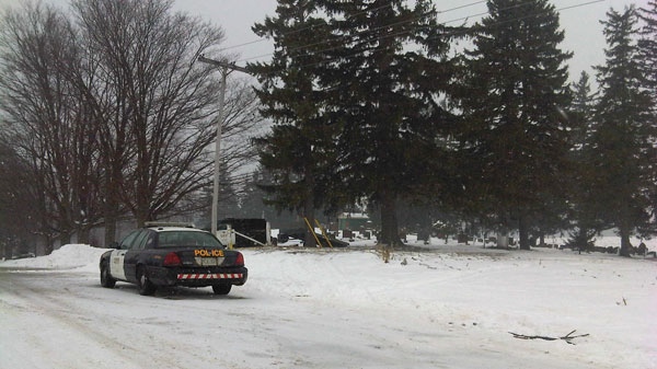 OPP vehicles are seen in the area where the body of 57-year-old Brenda Duncan was found near Tavistock, Ont. on Tuesday, Jan. 18, 2011.