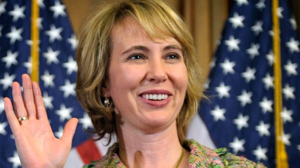 Rep. Gabrielle Giffords, D-Ariz., takes part in a reenactment of her swearing-in, on Capitol Hill in Washington, Jan. 5, 2011. (AP / Susan Walsh)