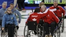 Canada's Jim Armstrong, second right, and Ina Forrest embrace as Darryl Neighbour and Sonja Gaudet celebrate while Sweden's Jalle Jungnell, Anette Wilhelm and Patrik Burman leave the ice following the gold medal game at the 2009 World Wheelchair Curling Championship in Vancouver, B.C., on Saturday, Feb. 28, 2009. (Darryl Dyck / THE CANADIAN PRESS)