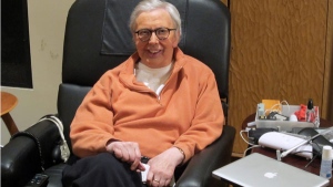 This January, 2011, photo provided by Roger Ebert shows the famous film critic wearing a silicone prosthesis over his lower face and neck. (AP Photo / Ebert Productions, David Rotter)