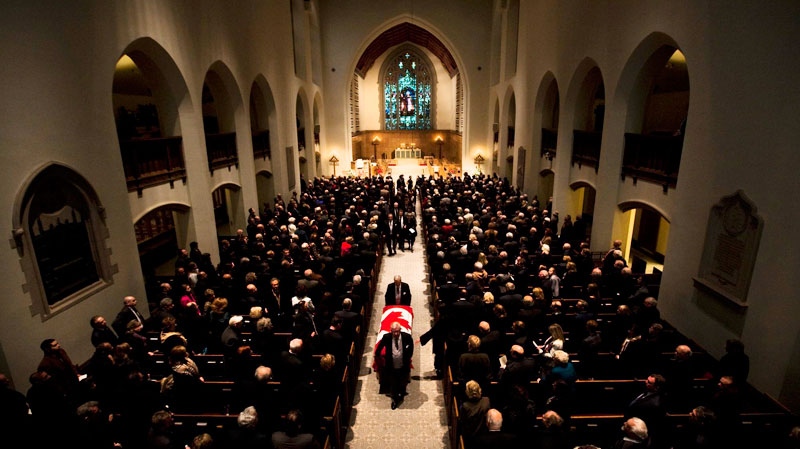 The casket of former Liberal senator Keith Davey is carried out of Timothy Eaton Memorial Church during Davey's funeral in Toronto, Ont. Friday, January 21, 2011. (Darren Calabrese / THE CANADIAN PRESS)