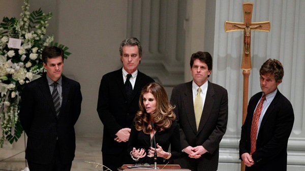Maria Shriver, centre, speaks as her brothers Tim Shriver, Bobby Shriver, Mark Shriver, Anthony Shriver stand behind her during the service for their father R. Sargent Shriver at Holy Trinity Catholic Church in Washington Friday, Jan. 21, 2011. (AP Photo / Alex Brandon)