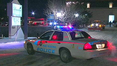 A police cruiser is shown outside the Paradise Banquet Hall in Vaughan, where a man was murdered, Friday, Jan. 21, 2011.