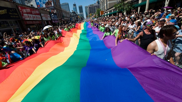 People take part in the Pride Parade in Toronto on Sunday, July 4, 2010. (Adrien Veczan/THE CANADIAN PRESS)
