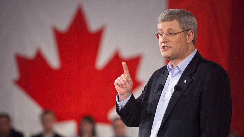 Prime Minister Stephen Harper gestures as he speaks to supporters of the Conservative Party during a speech in Ottawa on Sunday, January 23, 2011. (Pawel Dwulit / THE CANADIAN PRESS)