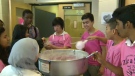 Students at John G. Diefenbaker wearing pink shirts and making cotton candy on Pink Shirt Day.
