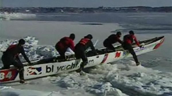 An ice canoe team prepares to head into the St. Lawrence River. (Jan. 24, 2011)