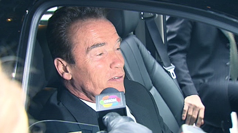 Arnold Schwarzenegger speaks to reporters after an appearance in Toronto on Wednesday, Jan. 26, 2011.
