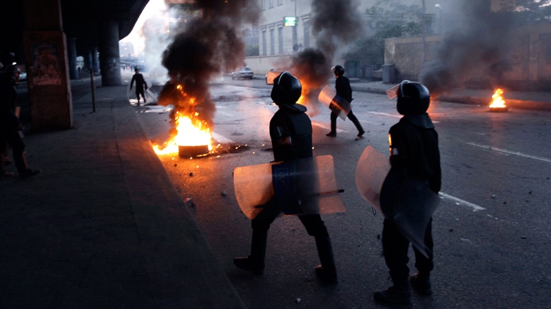 Egyptian riot police clash with anti-government activists in Cairo, Egypt, Wednesday, Jan. 26, 2011. (AP / Ben Curtis)