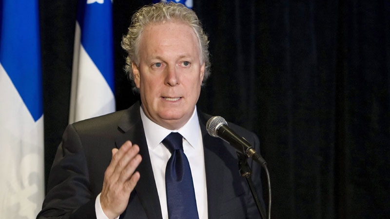 Quebec Premier Jean Charest speaks during a news conference to close a two-day meeting of the Quebec Liberal caucus Friday, January 21 2011, at Lac-Beauport, north of Quebec City. (THE CANADIAN PRESS/Clement Allard)