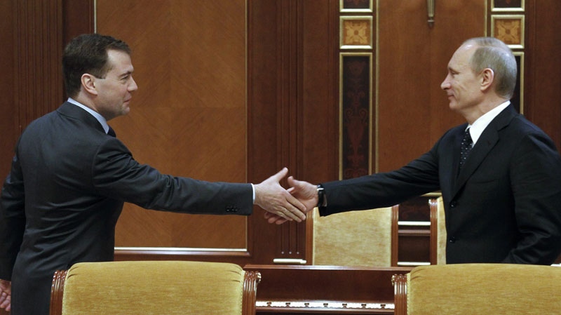 Russian President Dmitry Medvedev, left, shakes hands with Prime Minister Vladimir Putin, prior to a meeting of the Security Council at the Gorki presidential residence outside Moscow on Friday, Jan. 28, 2011. (AP /RIA Novosti, Dmitry Astakhov, Presidential Press Service)