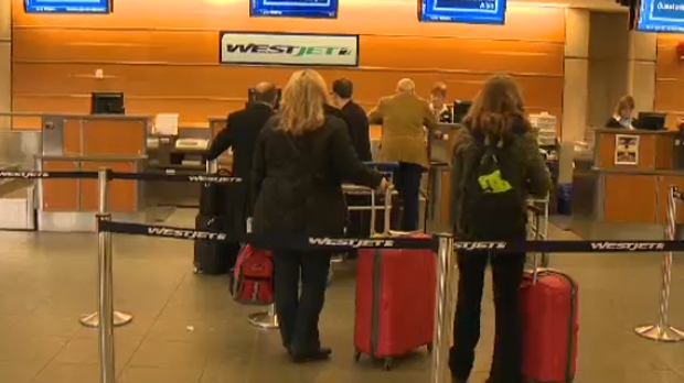 WestJet passengers at the Calgary International Airport