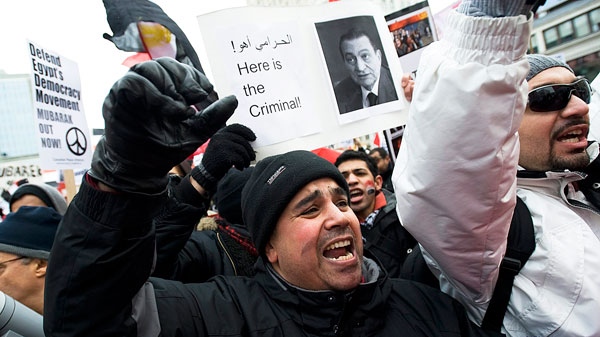Protesters gather at Dundas Square in Toronto to support the protests currently taking place in Egypt against President Hosni Mubarak on Saturday, January 29, 2011. (Aaron Vincent Elkaim / THE CANADIAN PRESS)
