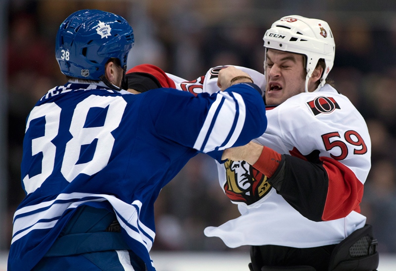 Toronto Maple Leafs left winger Frazer McLaren (38) knocks Ottawa Senators left winger Dave Dziurzynski out during a fight in first period NHL action in Toronto on Wednesday March 6, 2013. THE CANADIAN PRESS/Frank Gunn