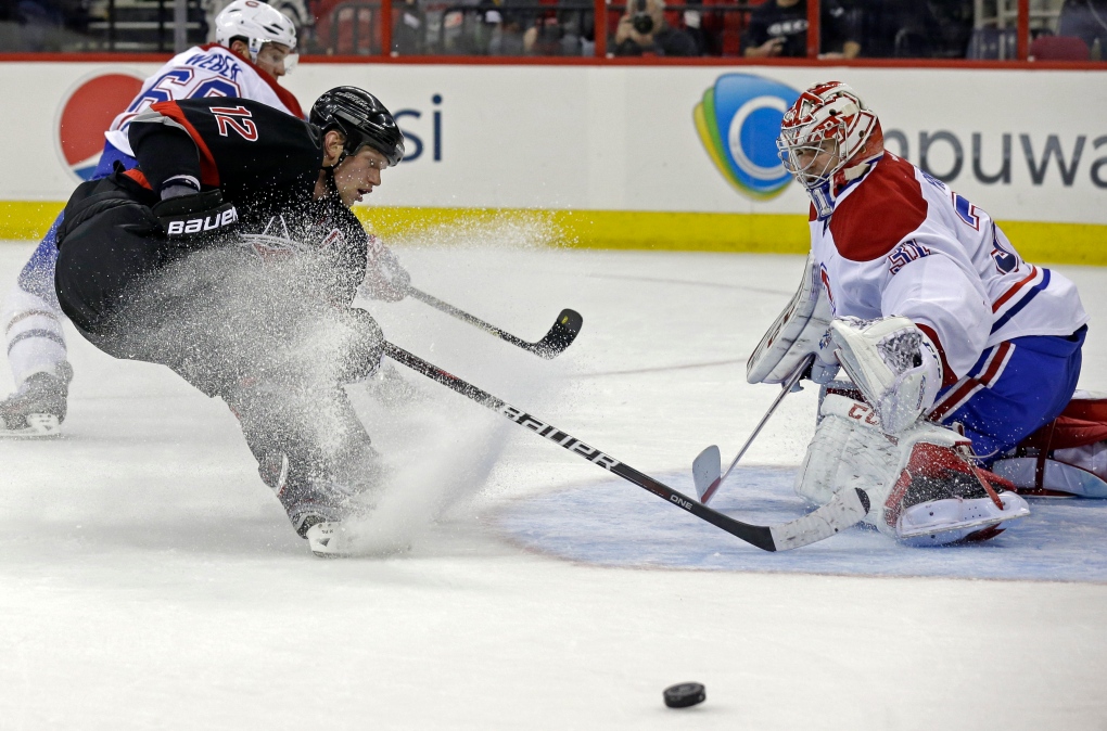 Carolina Hurricanes' Eric Staal (12) shoots while 