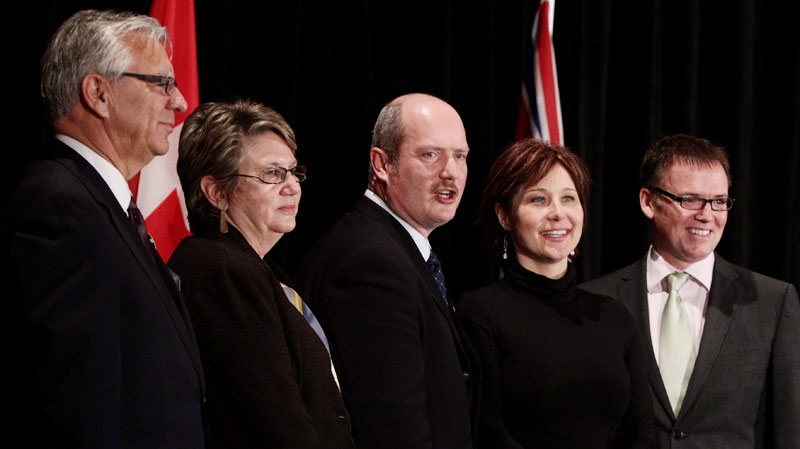 British Columbia Liberal leadership candidates Ed Mayne, from left, Moira Stilwell, Mike de Jong, Christy Clark and Kevin Falcon stand together during a photo-opportunity prior to speeches in Vancouver, B.C., on Wednesday January 12, 2011. (Darryl Dyck / THE CANADIAN PRESS)
