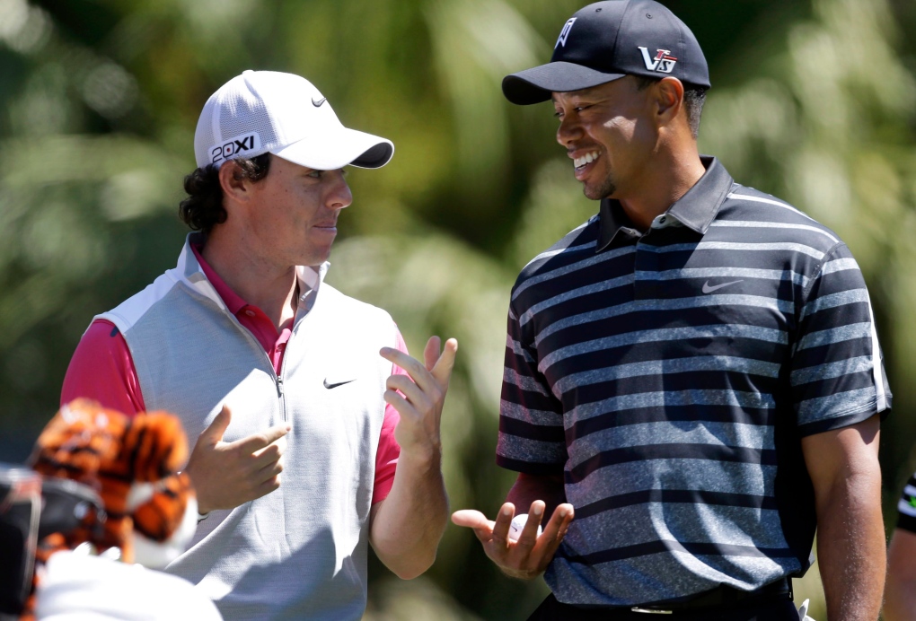Tiger Woods talks with Rory McIlroy
